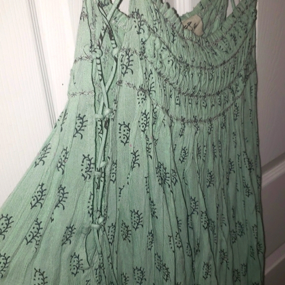 NWOT Free People  whimsical  dress with laces up the side.  Size M. NWOT - Picture 5 of 7